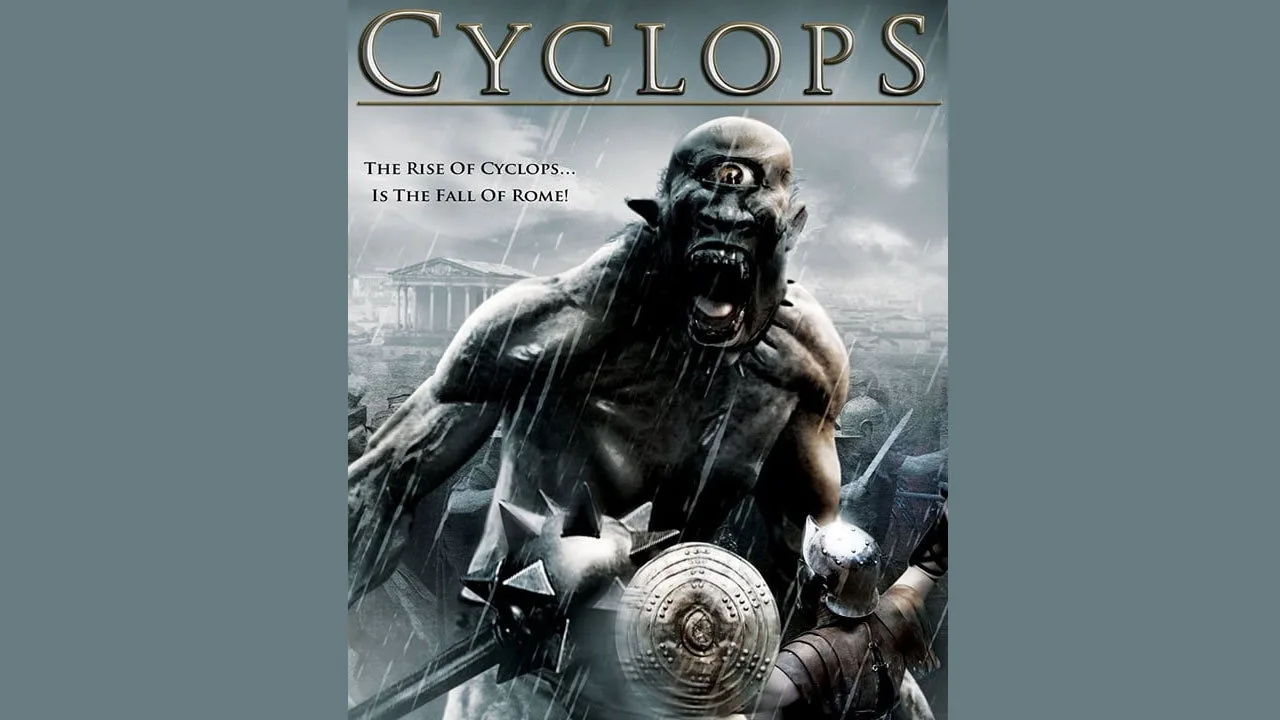 Ator vestindo traje de Cyclops levanta halteres ao lado de um rack de pesos, com fundo de logo dos X‑Men