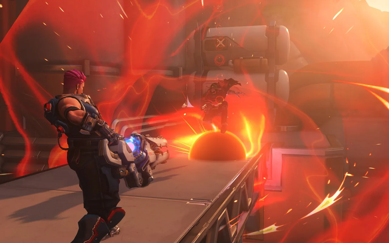 Um jogador vestindo roupa esportiva faz agachamento com halteres ao lado de um monitor exibindo o logo do Overwatch Stadium