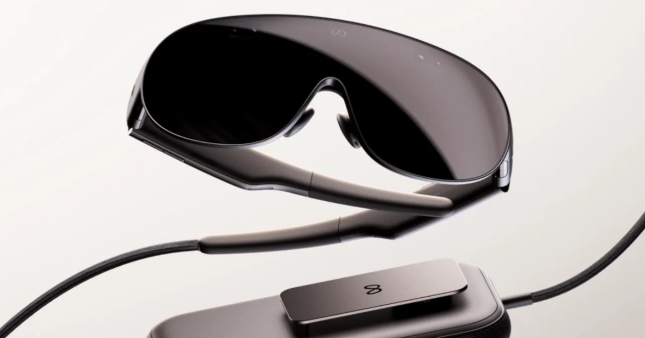 Meta VR Glasses prateados sobre fundo escuro, com logo da Meta ao lado e destaque para seu design leve de 100 g