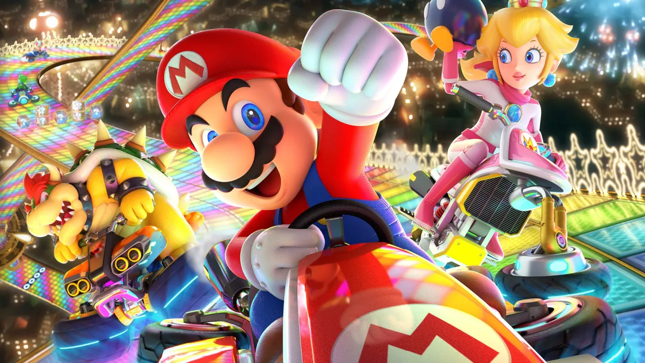 Jovem faz agachamento segurando o controle do Switch enquanto a tela exibe Mario Kart 8 Deluxe em modo multiplayer