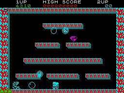 Jovem em roupa de academia faz agachamento segurando o controle do PS5 ao fundo, tela exibindo Bubble Bobble
