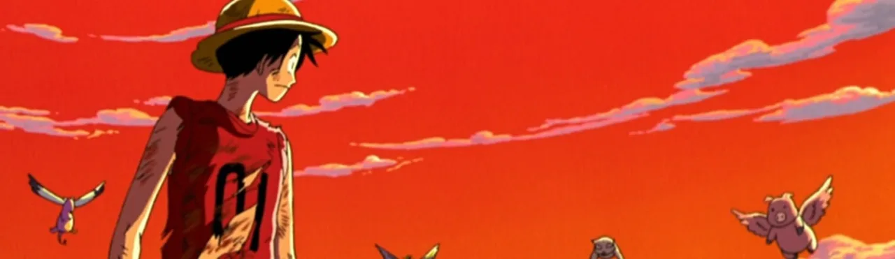 Adolescentes em camisetas de One Piece fazem agachamento com barra, ao fundo infláveis gigantes de Dorry e Brogy