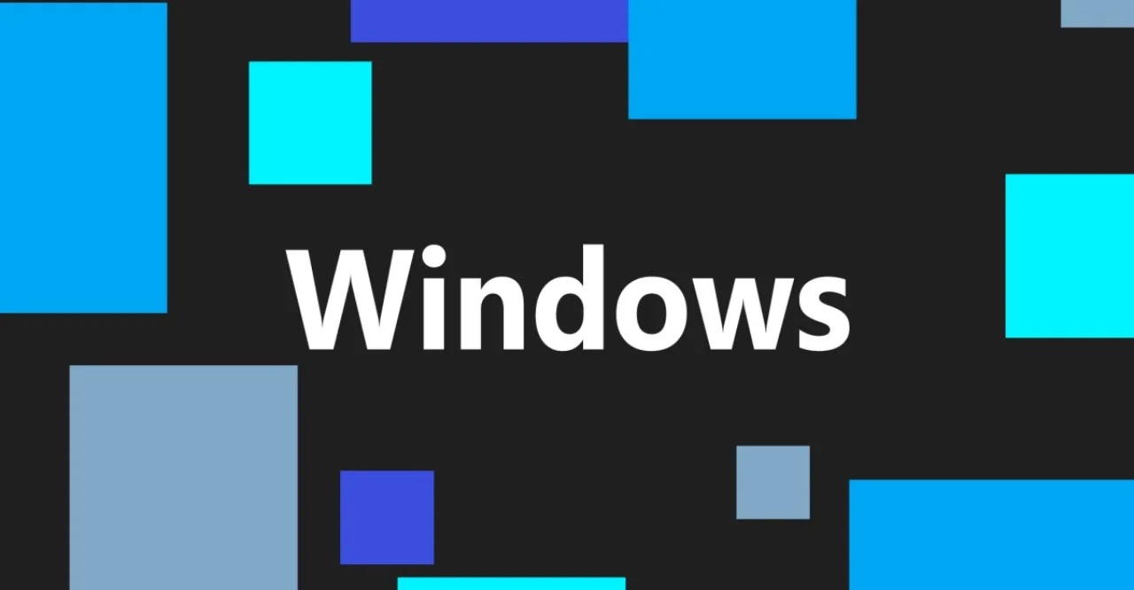 Pessoa no sofá, laptop aberto exibindo aviso de pausa indefinida de atualizações do Windows 11