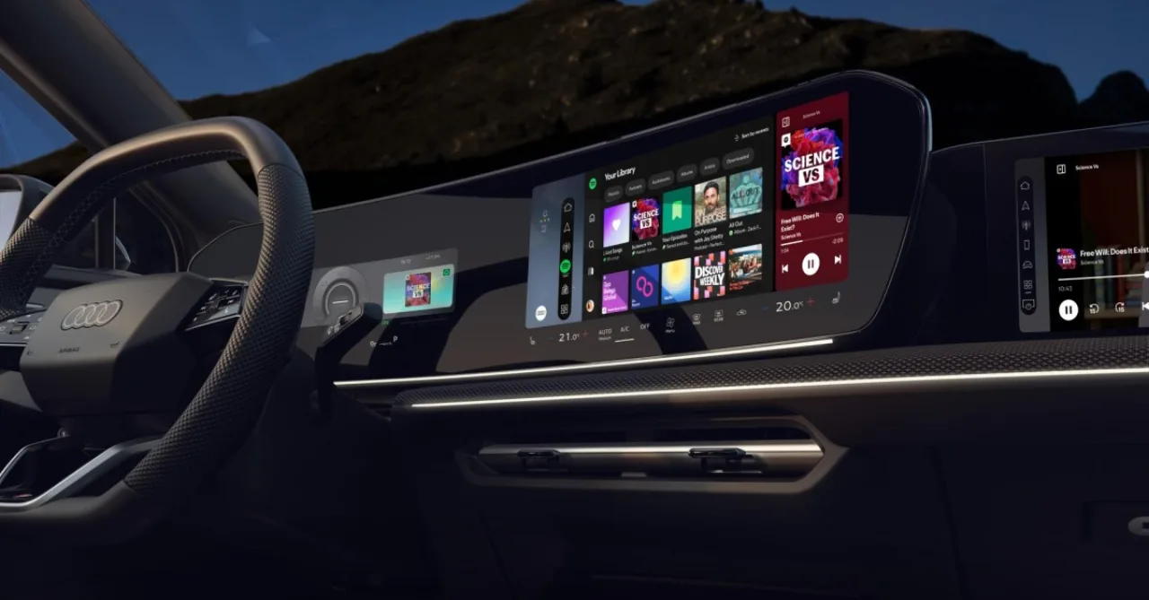 Tela de infotainment de um Audi exibindo o ícone verde do Spotify rodando nativamente no sistema Android Automotive